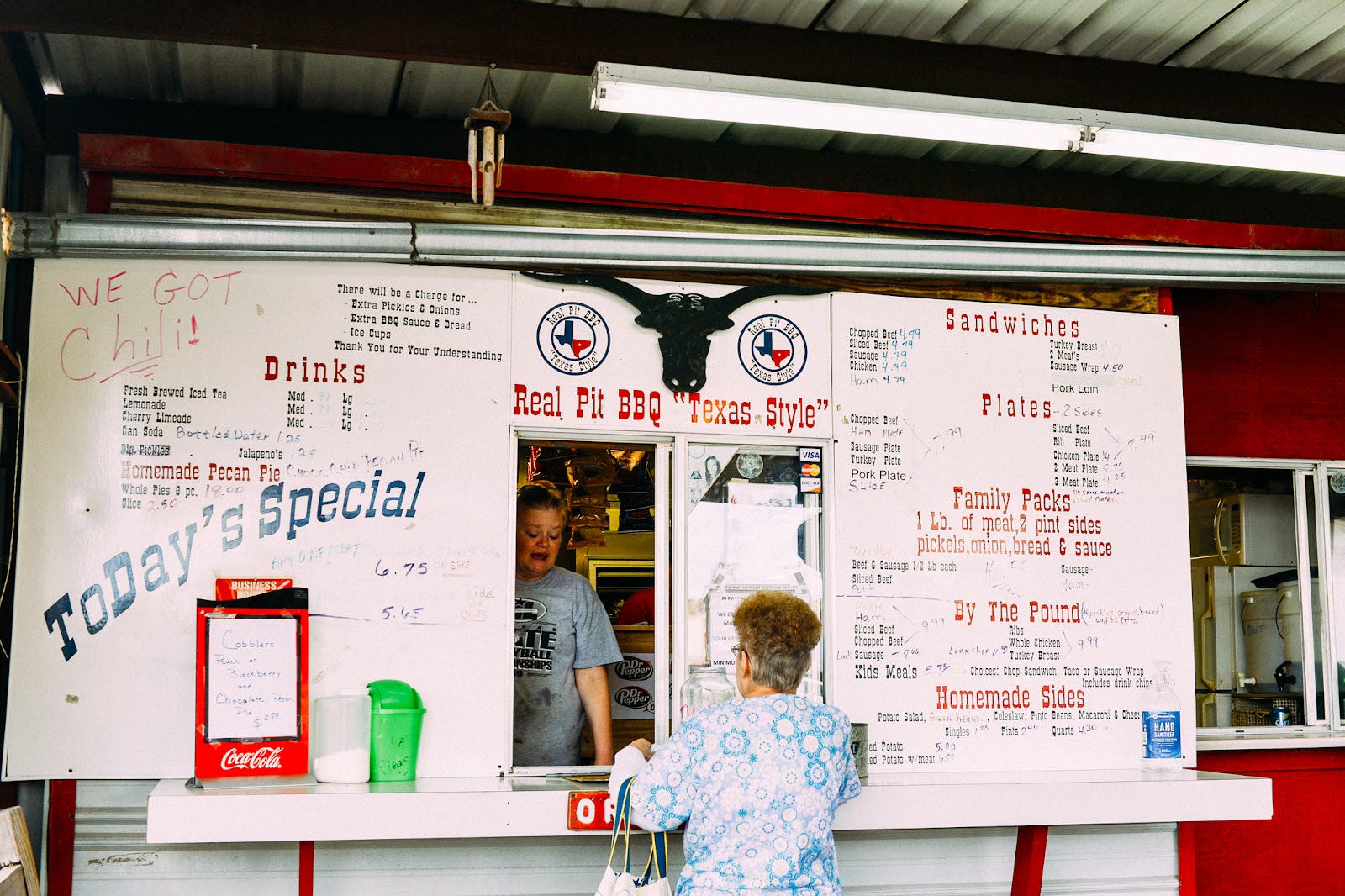 Hand-lettered menu board at the order window